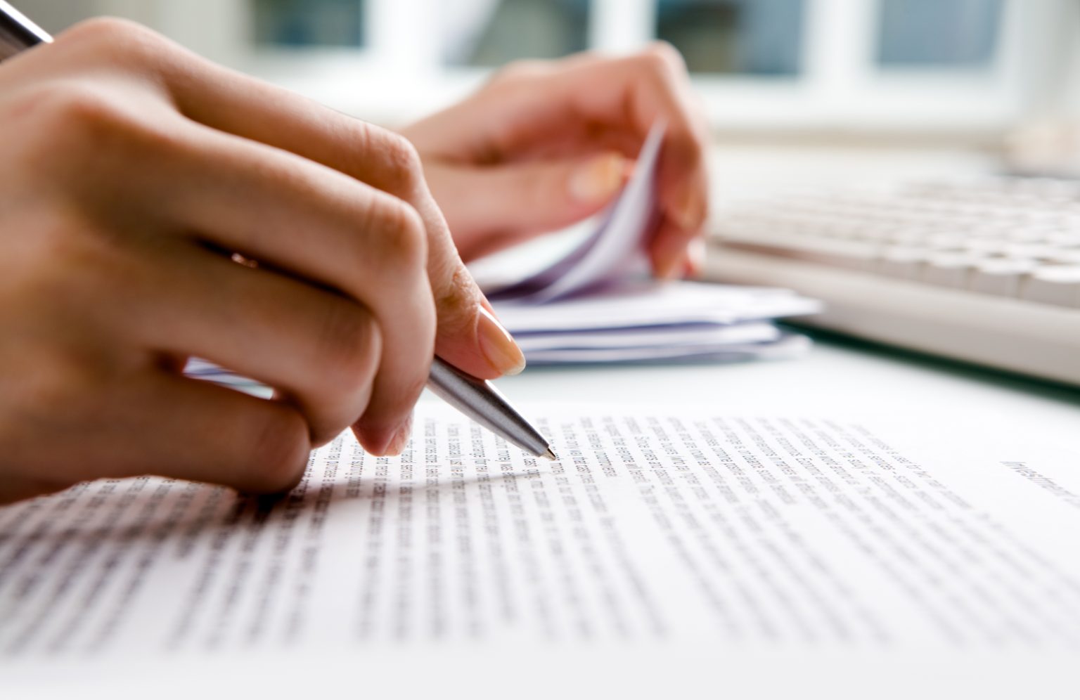 Close-up of secretary’s hands doing paperwork